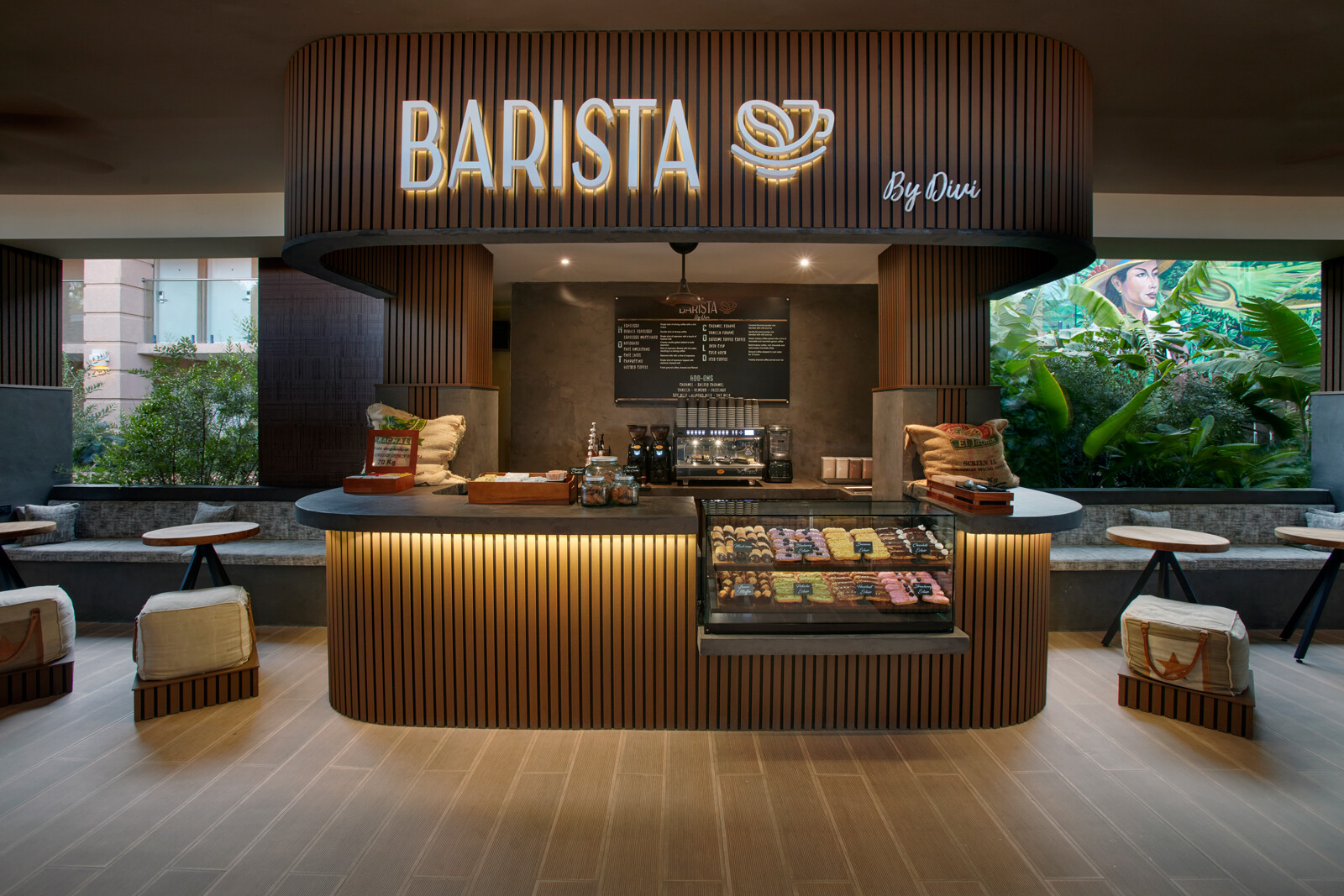 A cafe with seating and a garden