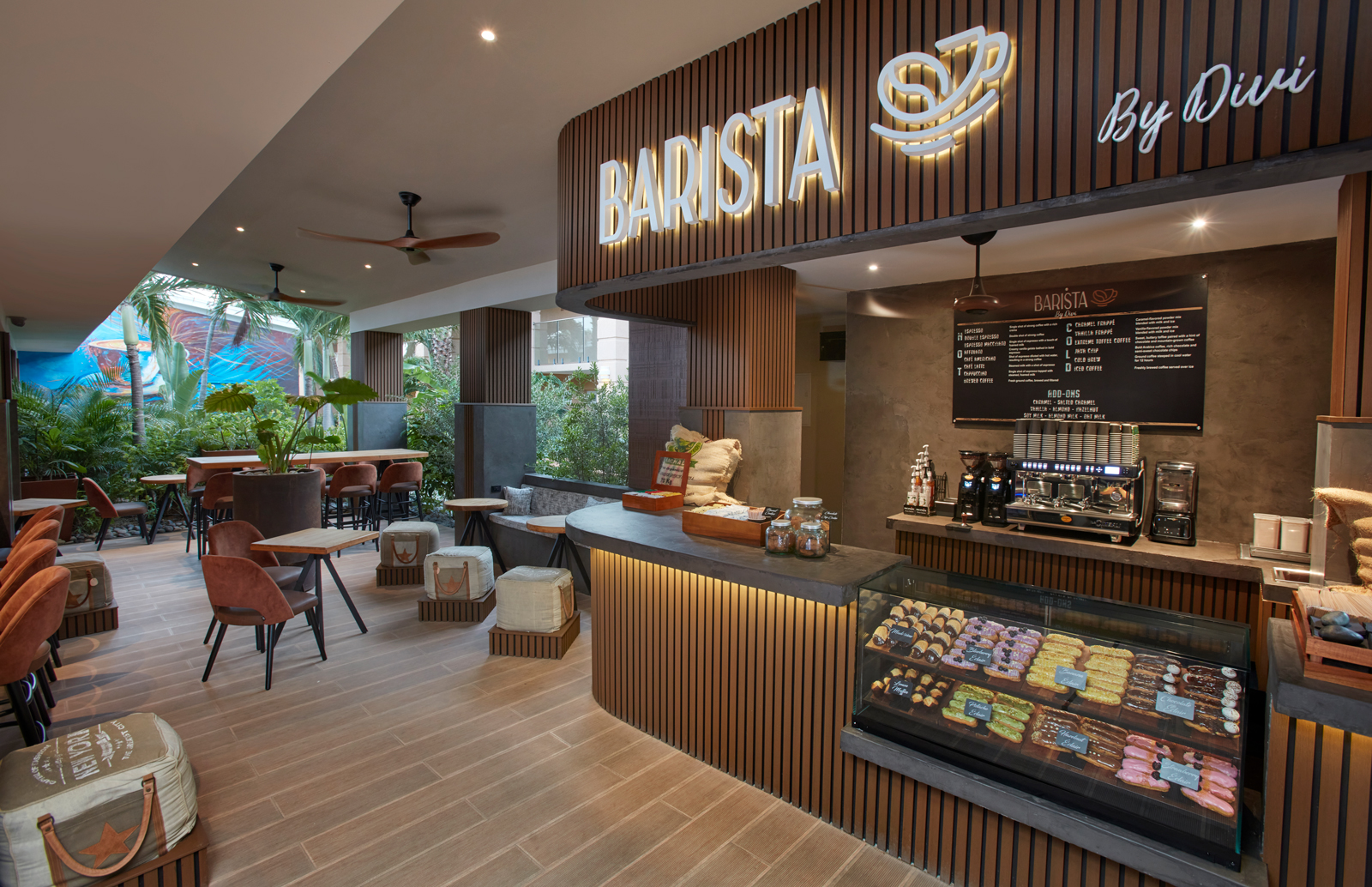 a coffee shop with a sign and a table