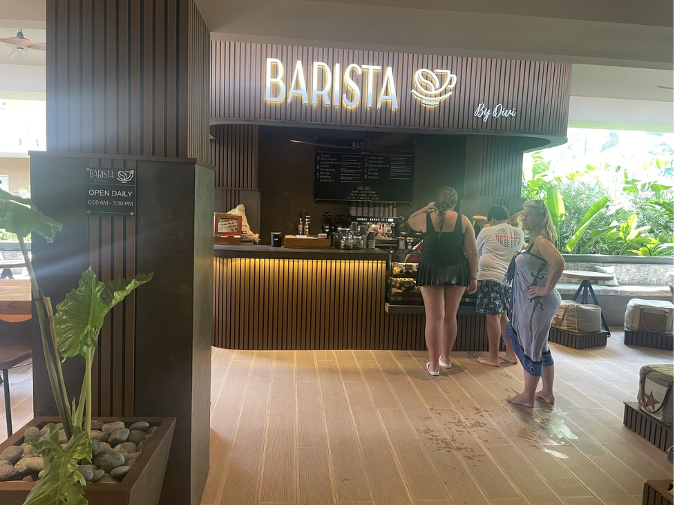 people standing in front of a coffee shop