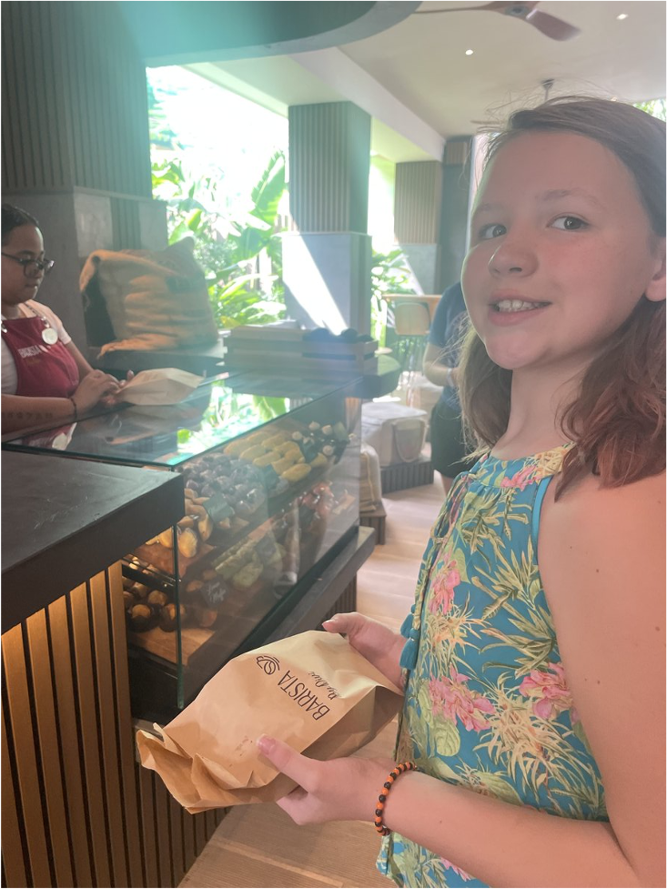 a girl holding a bag of food