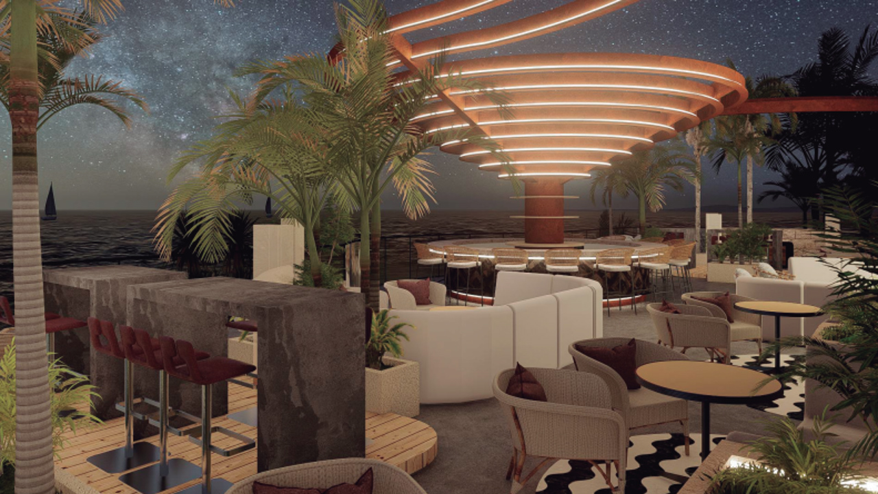 a restaurant with a large canopy and tables and chairs